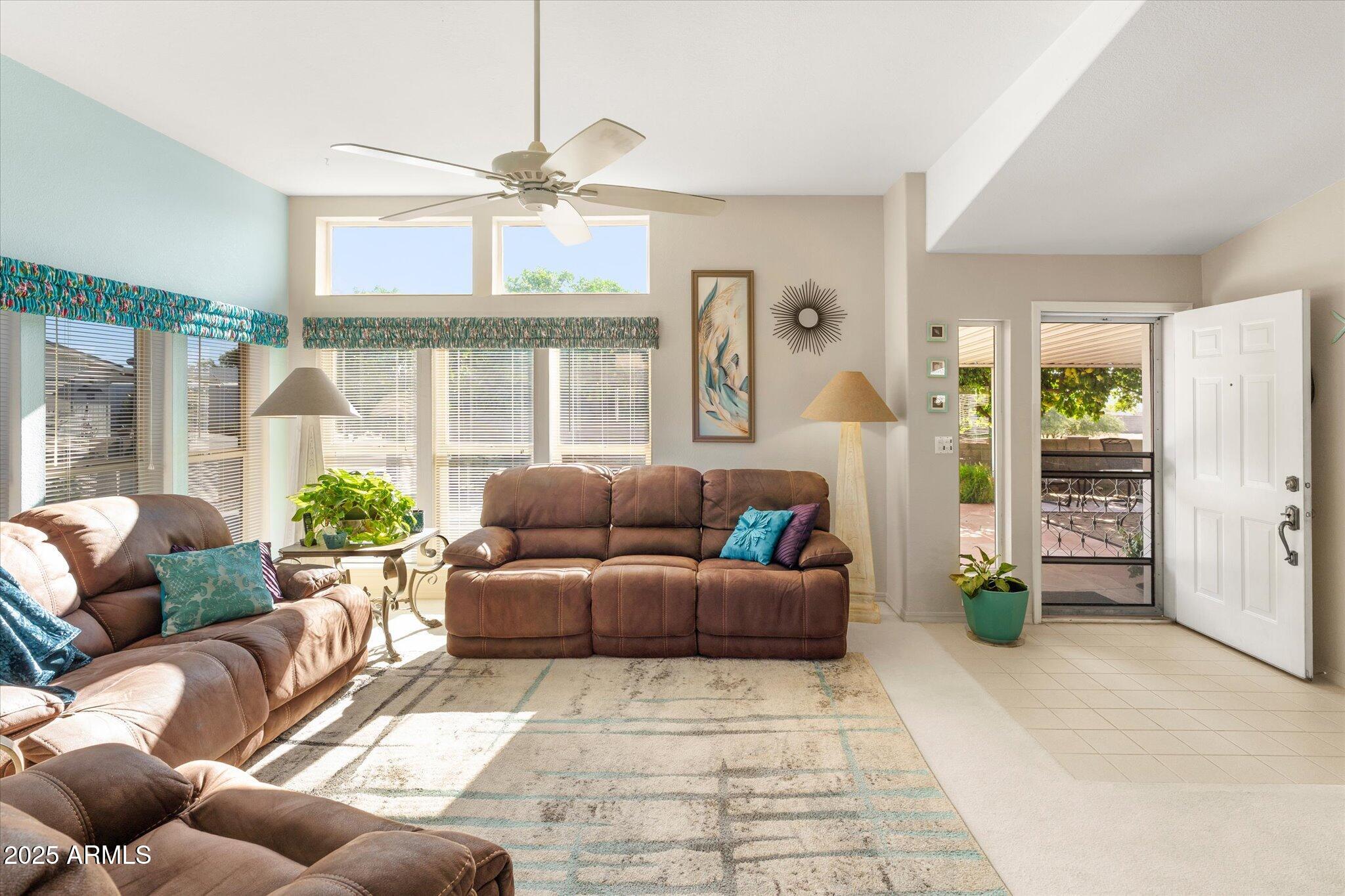 3700 South Tomahawk Road, Unit 26 & 27 Apache Junction, AZ 85119 - Photo 19 of 62 a living room with furniture and a large window