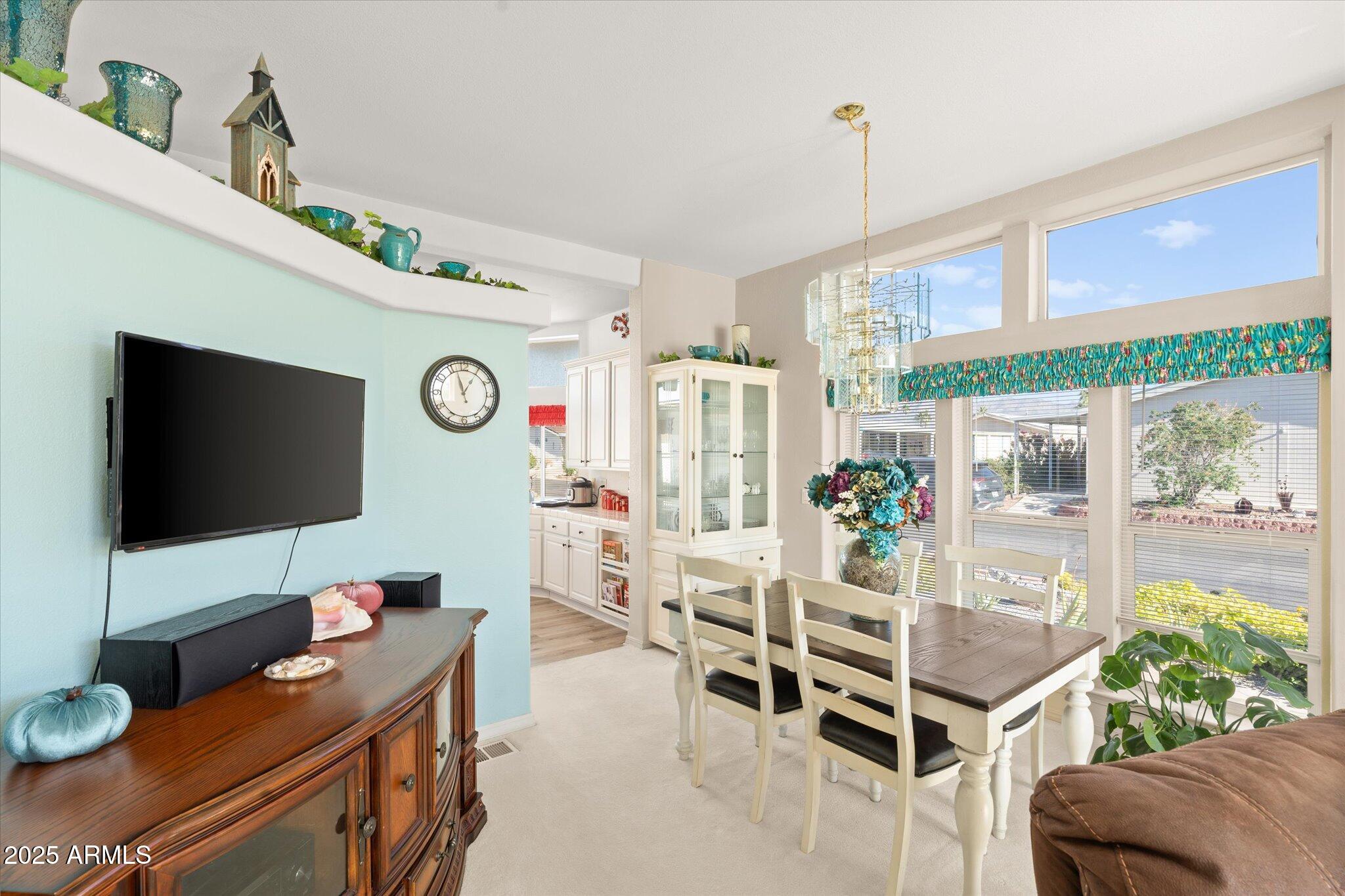 3700 South Tomahawk Road, Unit 26 & 27 Apache Junction, AZ 85119 - Photo 20 of 62 a living room with furniture and a flat screen tv