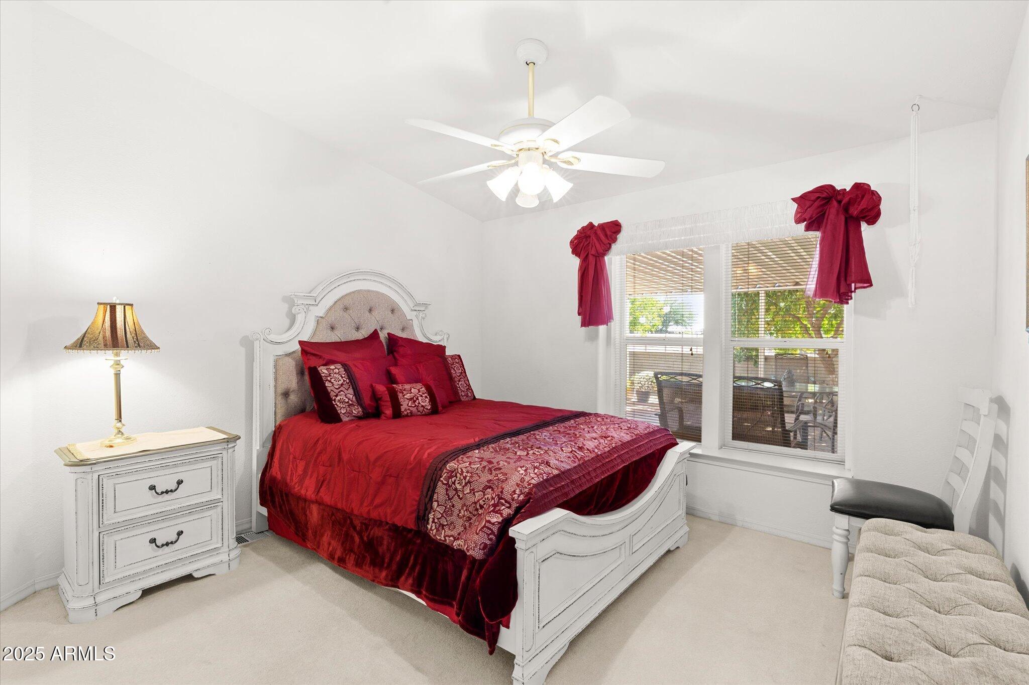 3700 South Tomahawk Road, Unit 26 & 27 Apache Junction, AZ 85119 - Photo 34 of 62 a bedroom with a bed and a window