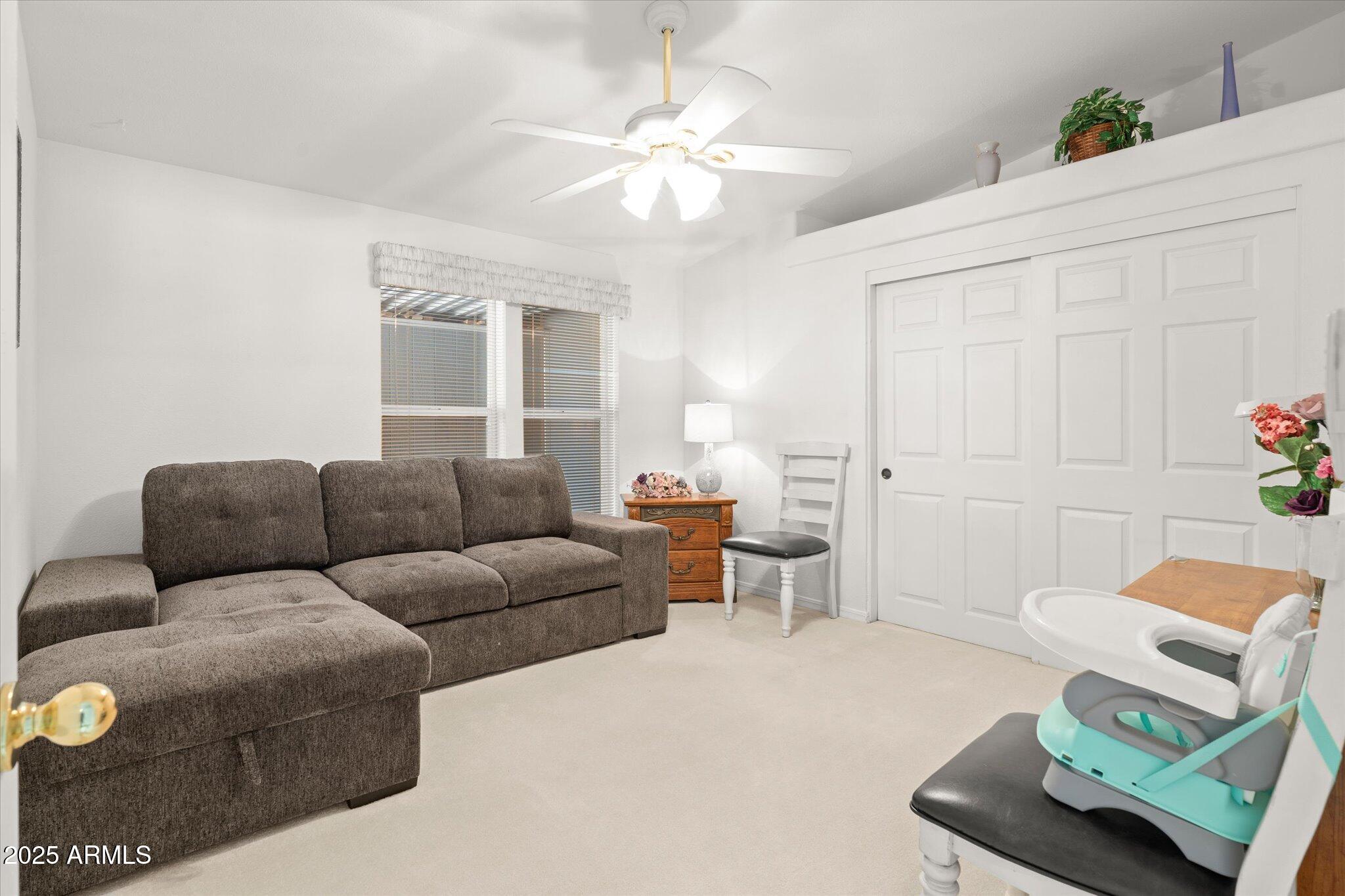 3700 South Tomahawk Road, Unit 26 & 27 Apache Junction, AZ 85119 - Photo 39 of 62 a living room with furniture and a window