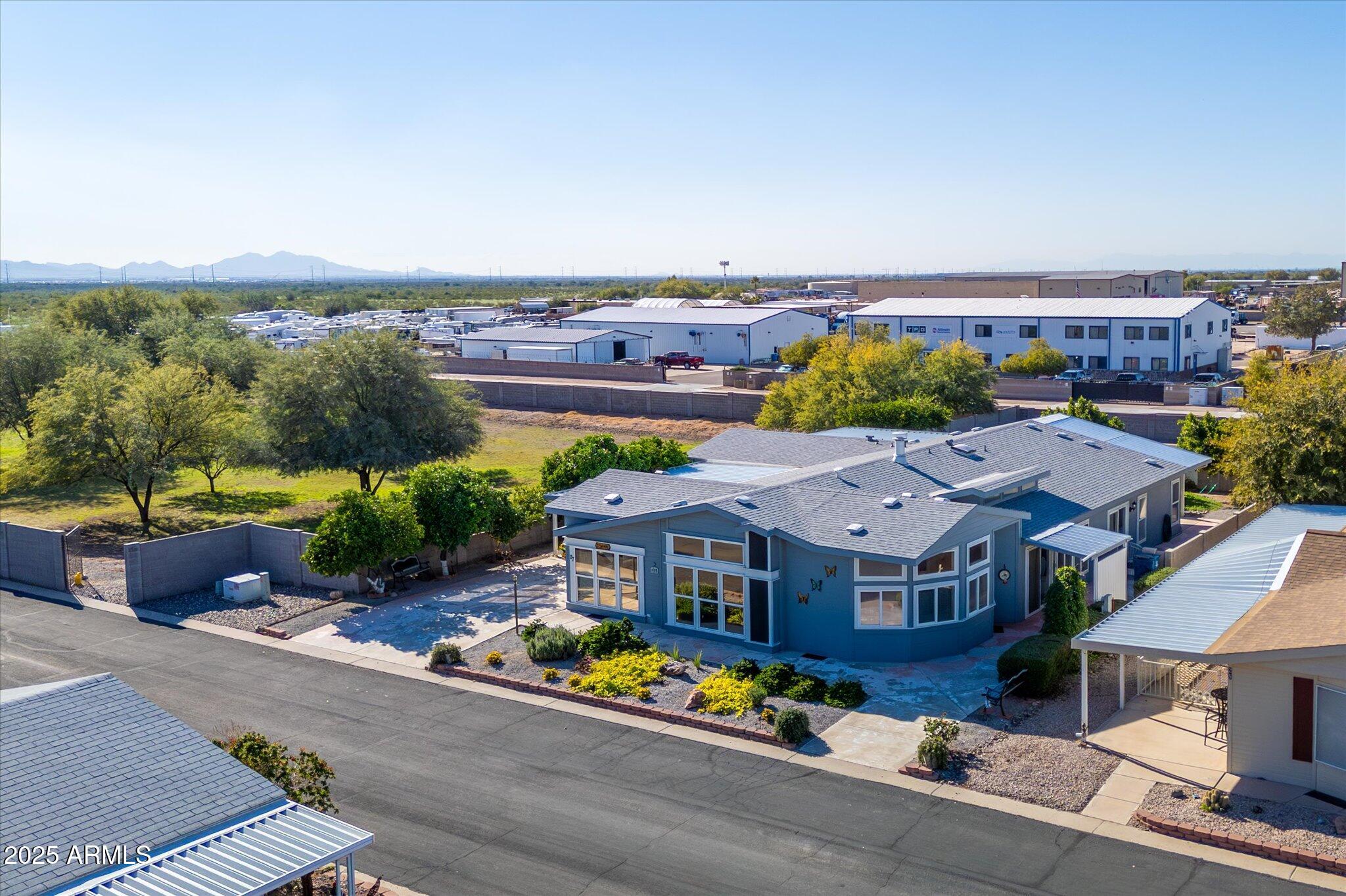 3700 South Tomahawk Road, Unit 26 & 27 Apache Junction, AZ 85119 - Photo 44 of 62 an aerial view of a house with a garden