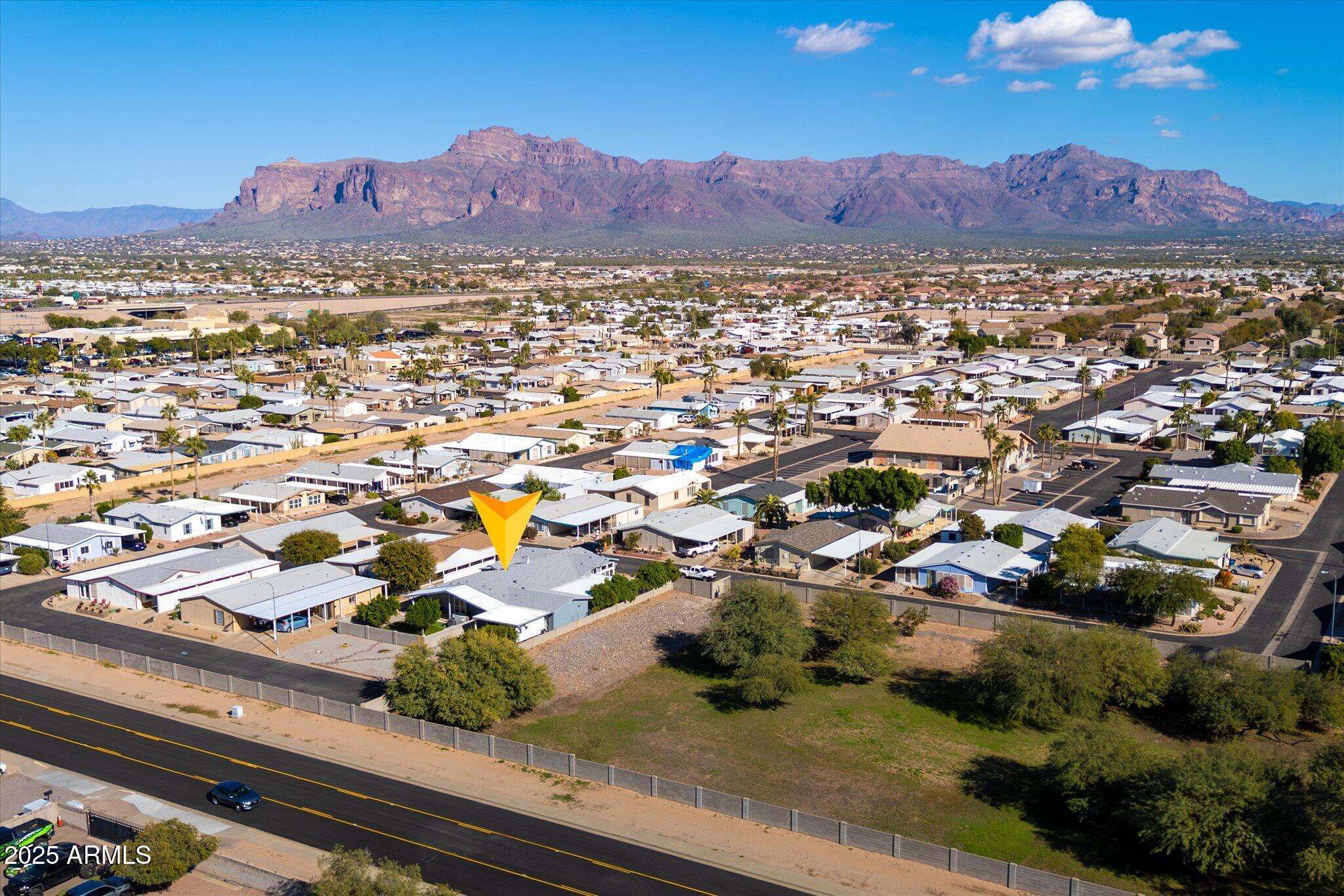 3700 South Tomahawk Road, Unit 26 & 27 Apache Junction, AZ 85119 - Photo 56 of 62 an aerial view of residential houses and outdoor space