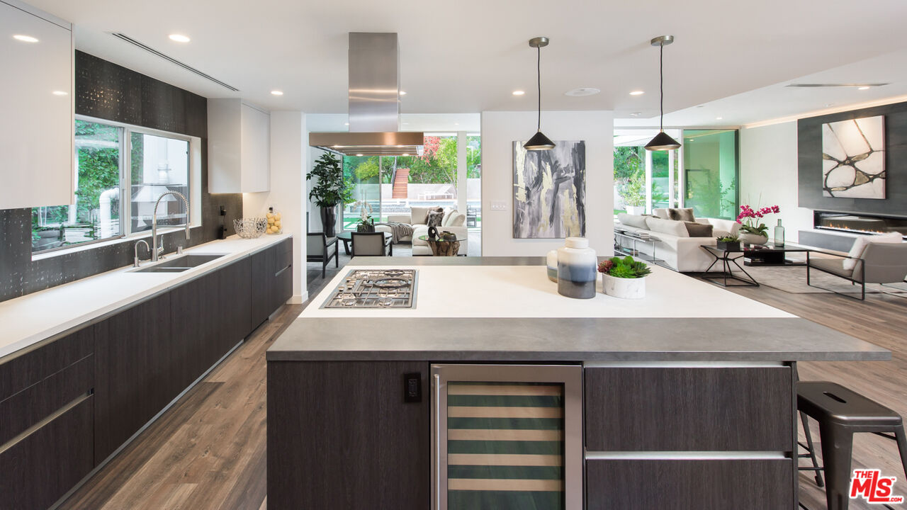 2213 Roscomare Road Los Angeles, CA 90077 - Photo 11 of 46 a kitchen with a sink a counter top space and living room view