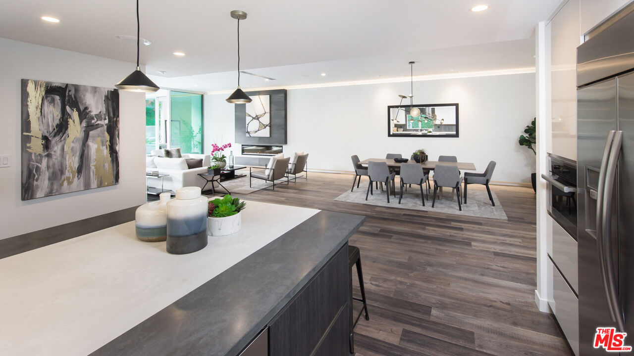 2213 Roscomare Road Los Angeles, CA 90077 - Photo 12 of 46 a view of dining table and chairs