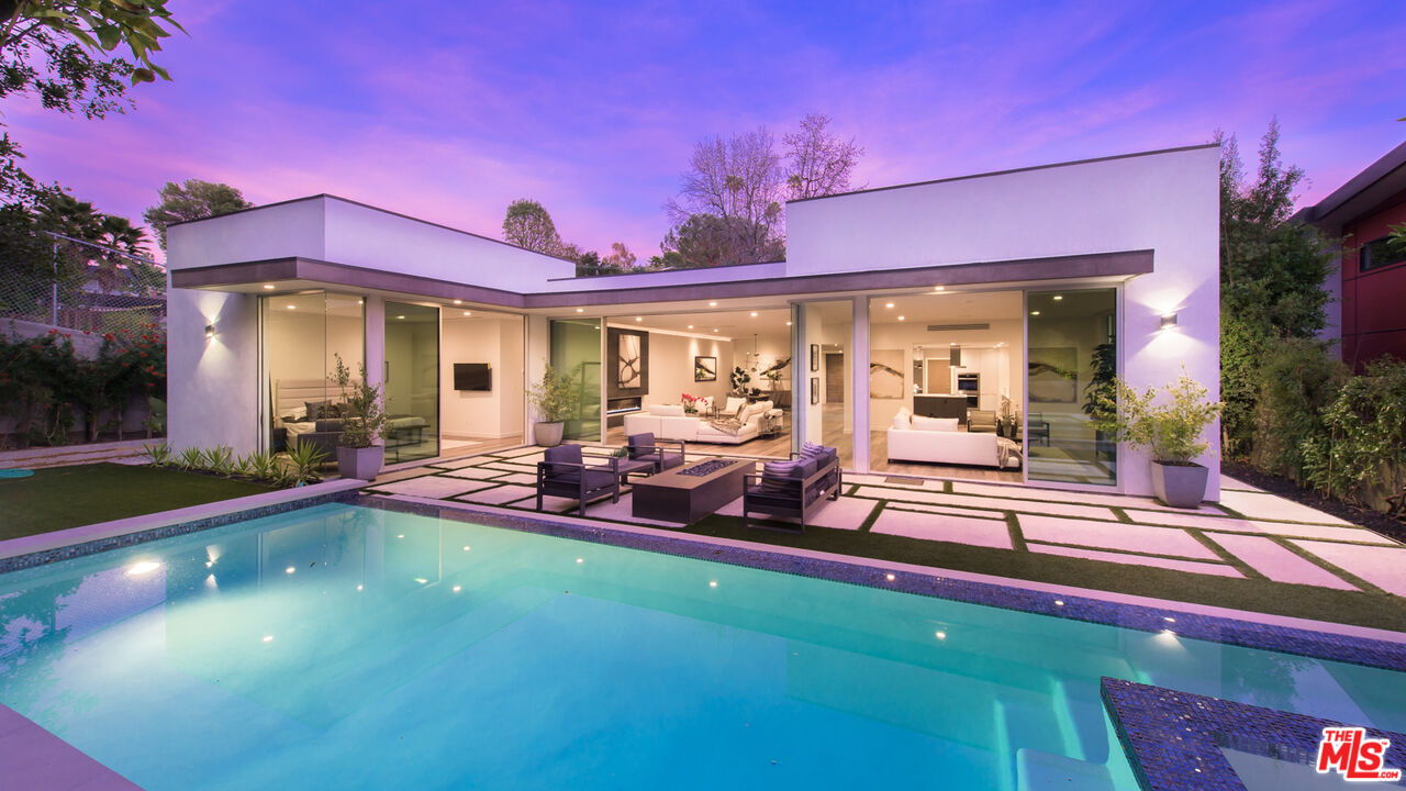 2213 Roscomare Road Los Angeles, CA 90077 - Photo 27 of 46 a view of a house with swimming pool and sitting area