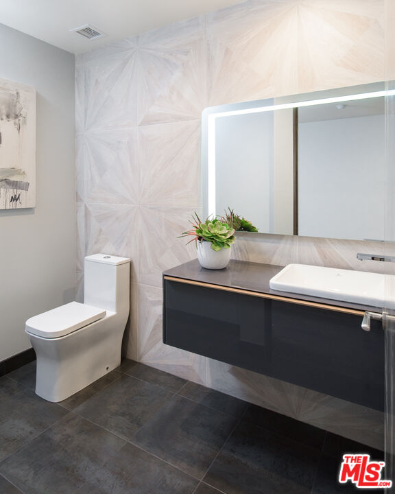 2213 Roscomare Road Los Angeles, CA 90077 - Photo 46 of 46 a bathroom with a sink and a toilet