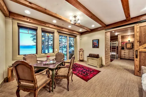 a view of a bedroom with furniture and window