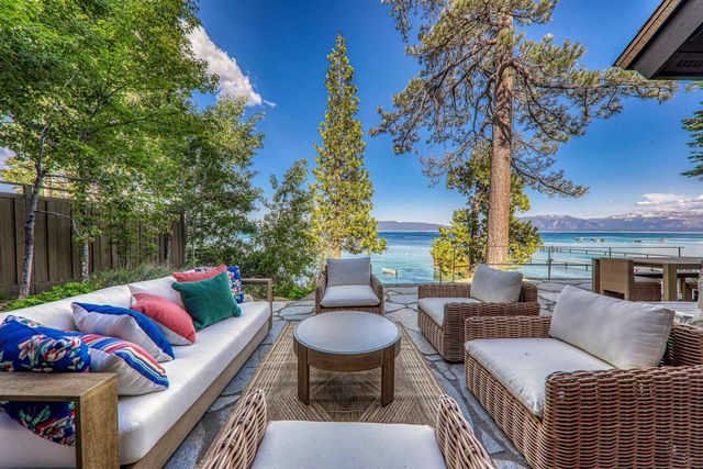 a view of a street with a tree in the background