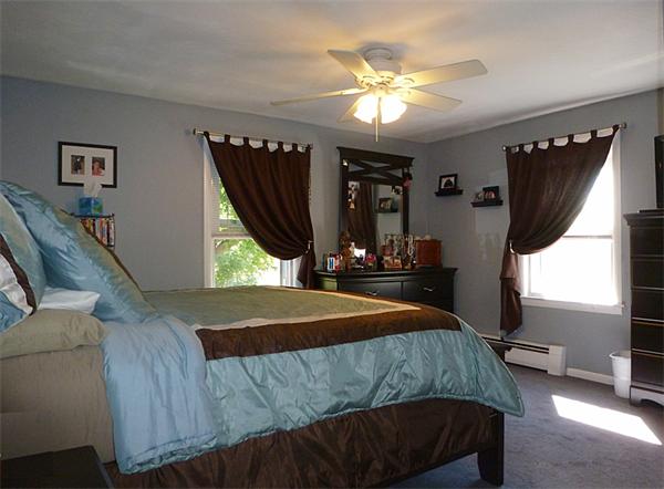 41 Bethany Road Monson, MA 01057 - Photo 14 of 24 a bedroom with a bed and a chandelier