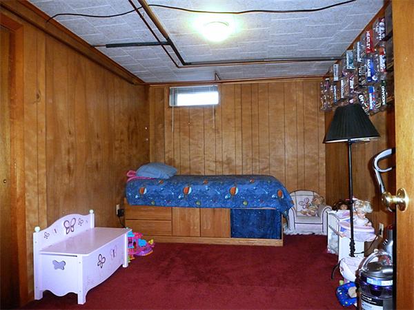 41 Bethany Road Monson, MA 01057 - Photo 20 of 24 a bedroom with a bed and a chandelier