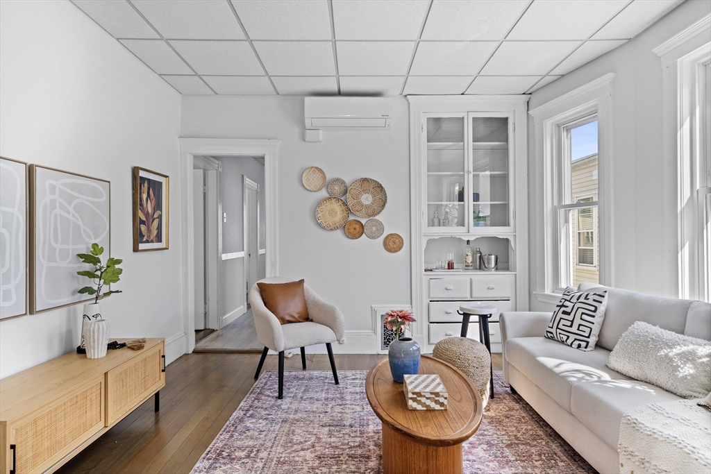 742 Bennington Street, Unit 3 Boston, MA 02128 - Photo 1 of 16 a living room with furniture and wooden floor