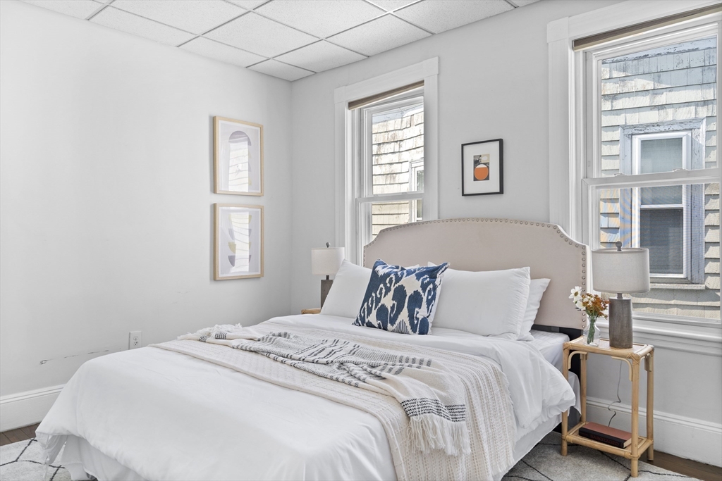 742 Bennington Street, Unit 3 Boston, MA 02128 - Photo 14 of 16 a bedroom with a bed and a window