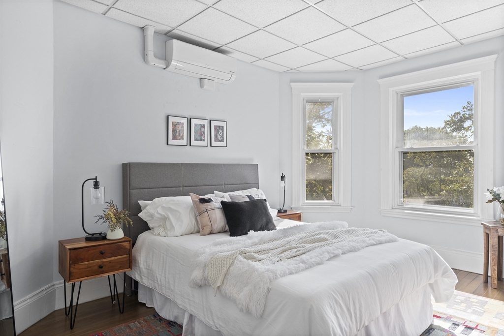 742 Bennington Street, Unit 3 Boston, MA 02128 - Photo 4 of 16 a bedroom with a bed and a window
