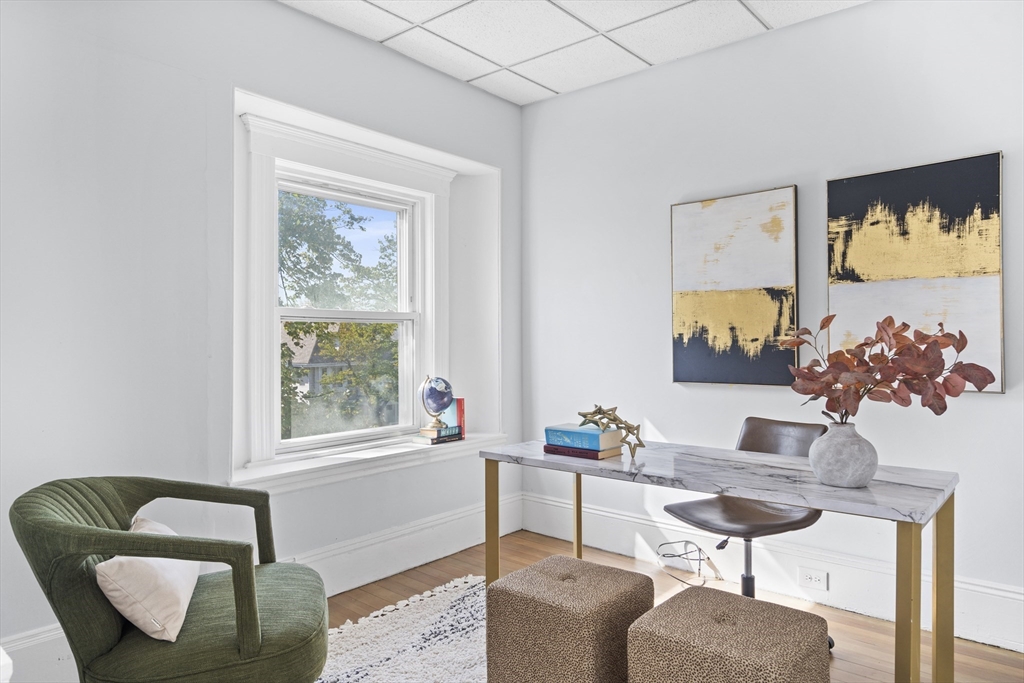 742 Bennington Street, Unit 3 Boston, MA 02128 - Photo 5 of 16 a work room with furniture and a window