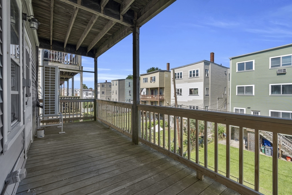 742 Bennington Street, Unit 3 Boston, MA 02128 - Photo 10 of 16 a view of a balcony with wooden floor