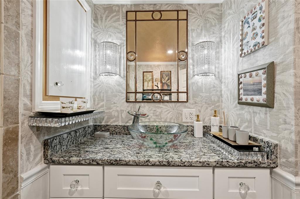 712 Roma Road Venice, FL 34285 - Photo 13 of 24 a bathroom with double sink and a mirror