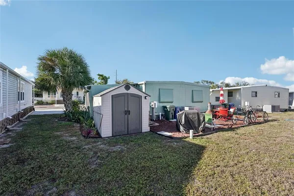 a view of a house with backyard space and porch