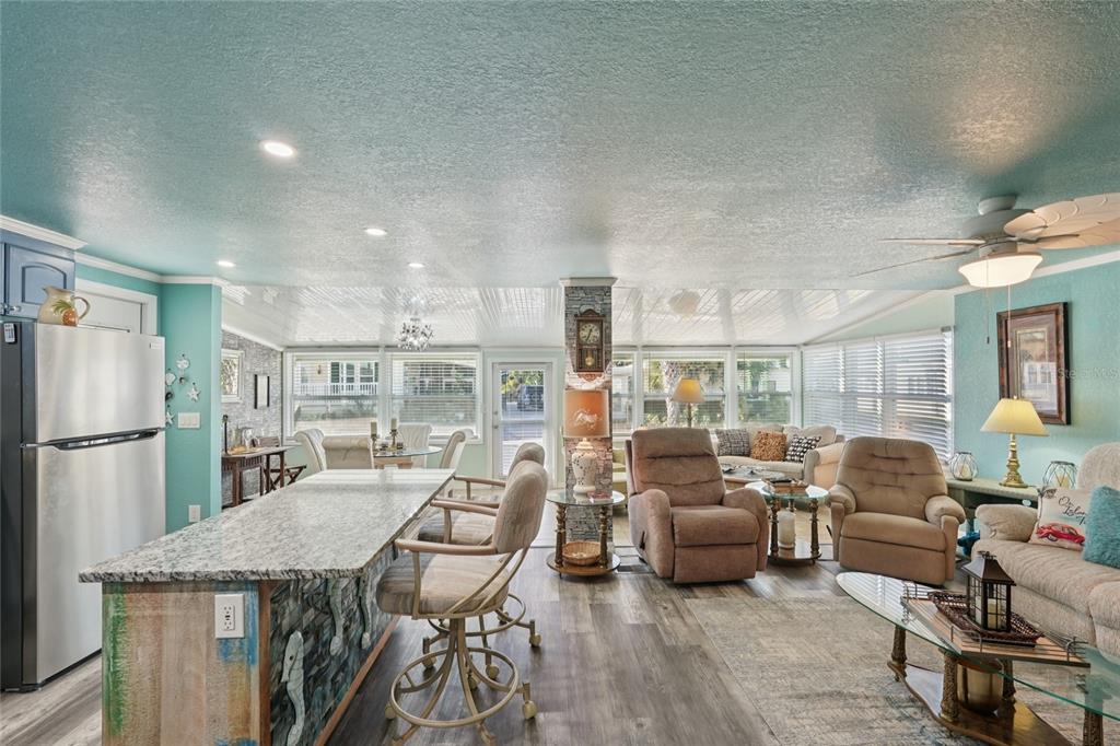 712 Roma Road Venice, FL 34285 - Photo 10 of 24 a living room with furniture and a table