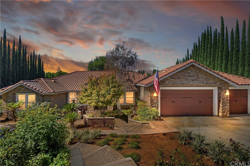 7717 Whitegate Avenue Riverside, CA 92506 - Photo 1 of 1 a front view of a house with a yard and garage