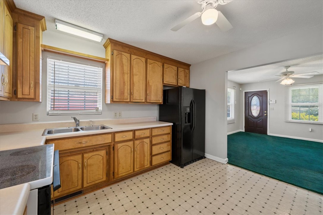 412 Carver Street Anderson, SC 29624 - Photo 12 of 23 This spacious kitchen offers functional design and ample cabinet space for all your culinary needs.