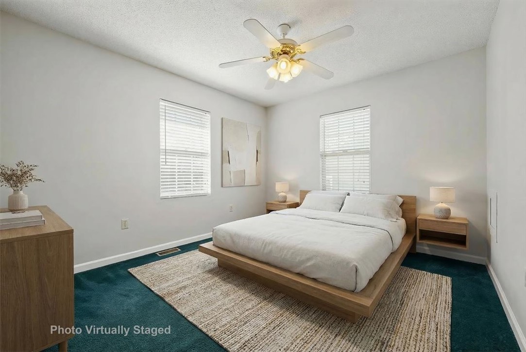412 Carver Street Anderson, SC 29624 - Photo 17 of 23 This serene bedroom offers a tranquil retreat with ample natural light.