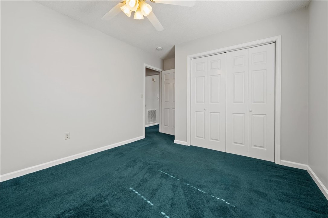 412 Carver Street Anderson, SC 29624 - Photo 18 of 23 This spacious bedroom features plush carpeting and convenient closet space.