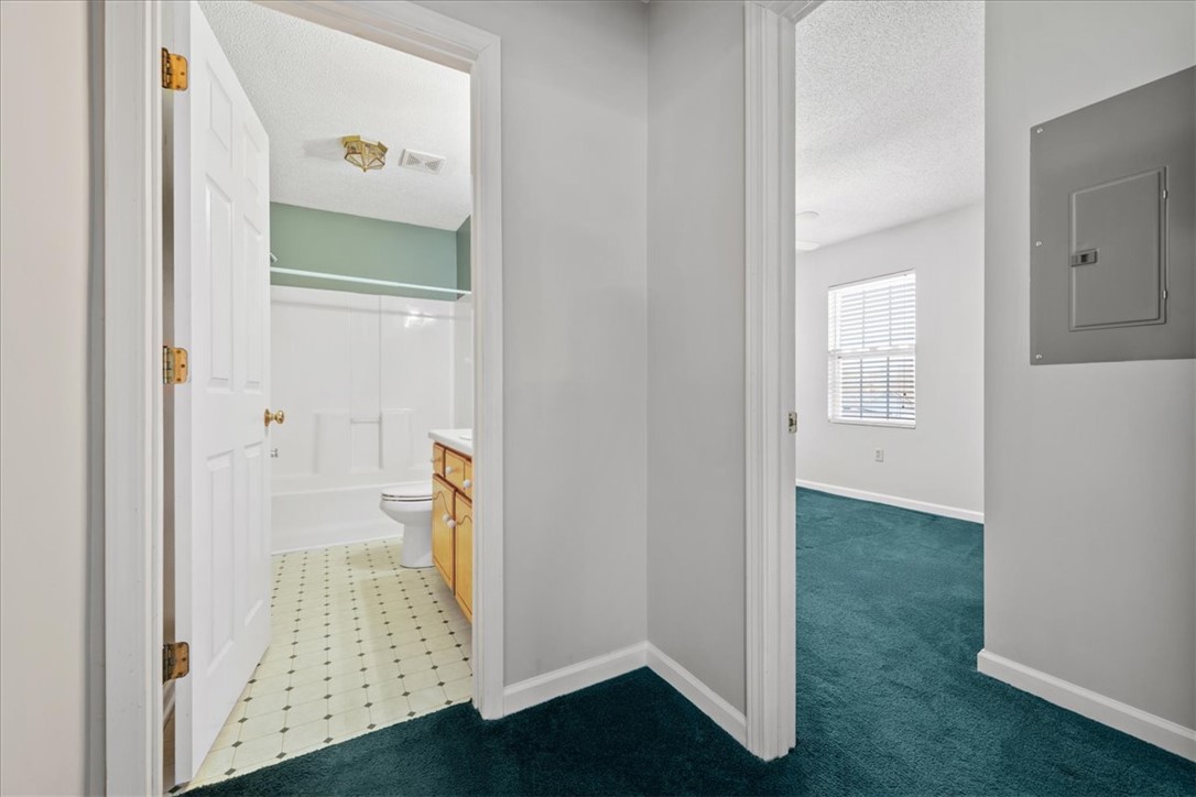 412 Carver Street Anderson, SC 29624 - Photo 19 of 23 This interior offers a well-appointed bathroom and a cozy living space, perfect for everyday comfort.