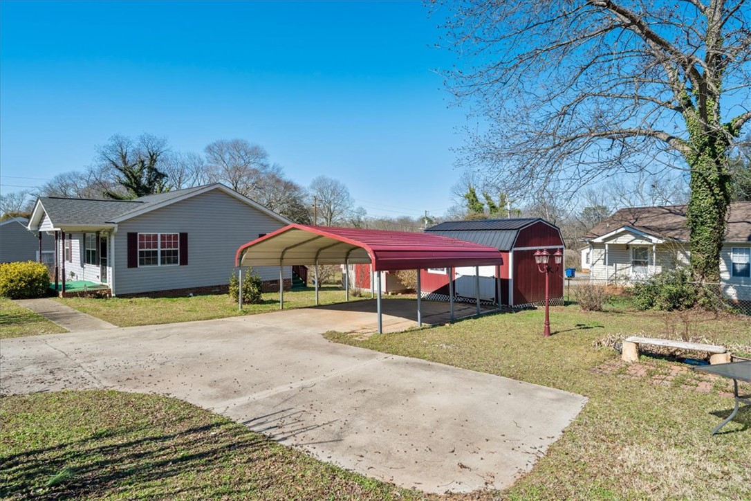 412 Carver Street Anderson, SC 29624 - Photo 4 of 23 This property features a welcoming exterior with practical parking solutions.