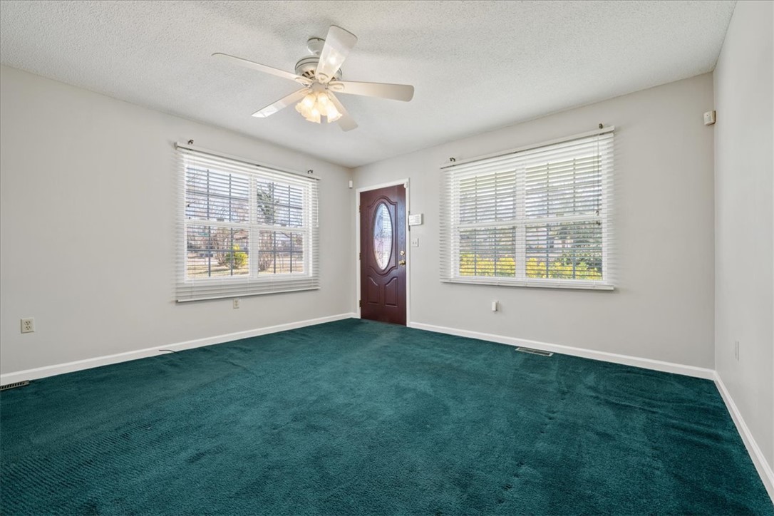 412 Carver Street Anderson, SC 29624 - Photo 5 of 23 This inviting living area features plush carpeting and abundant natural light, perfect for relaxation.