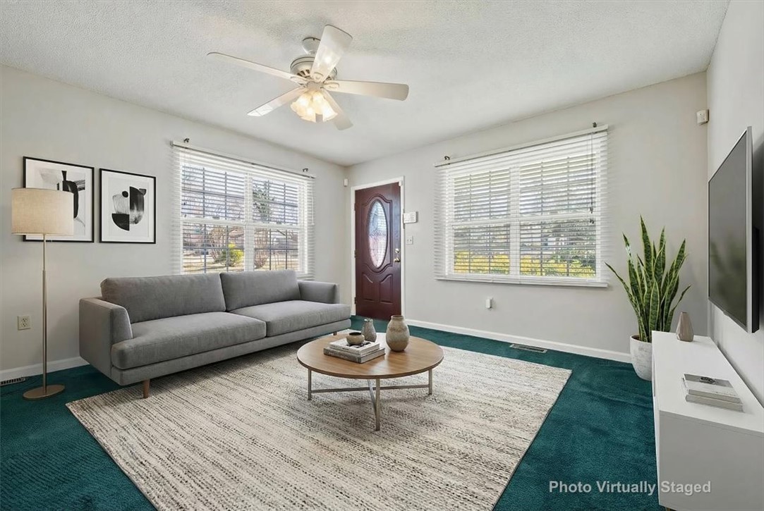 412 Carver Street Anderson, SC 29624 - Photo 6 of 23 This bright living space offers comfort and a welcoming atmosphere.