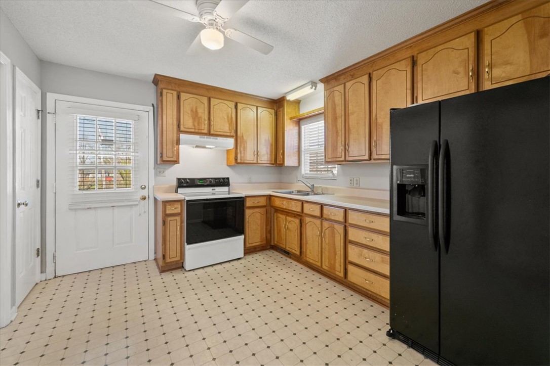 412 Carver Street Anderson, SC 29624 - Photo 8 of 23 This spacious kitchen offers ample cabinet storage and convenient access to the outdoors.