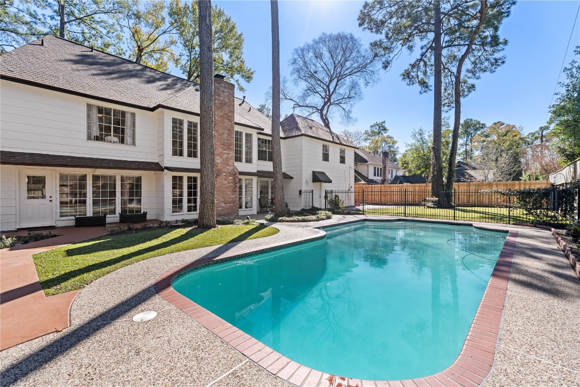 a view of a swimming pool with a lounge chairs