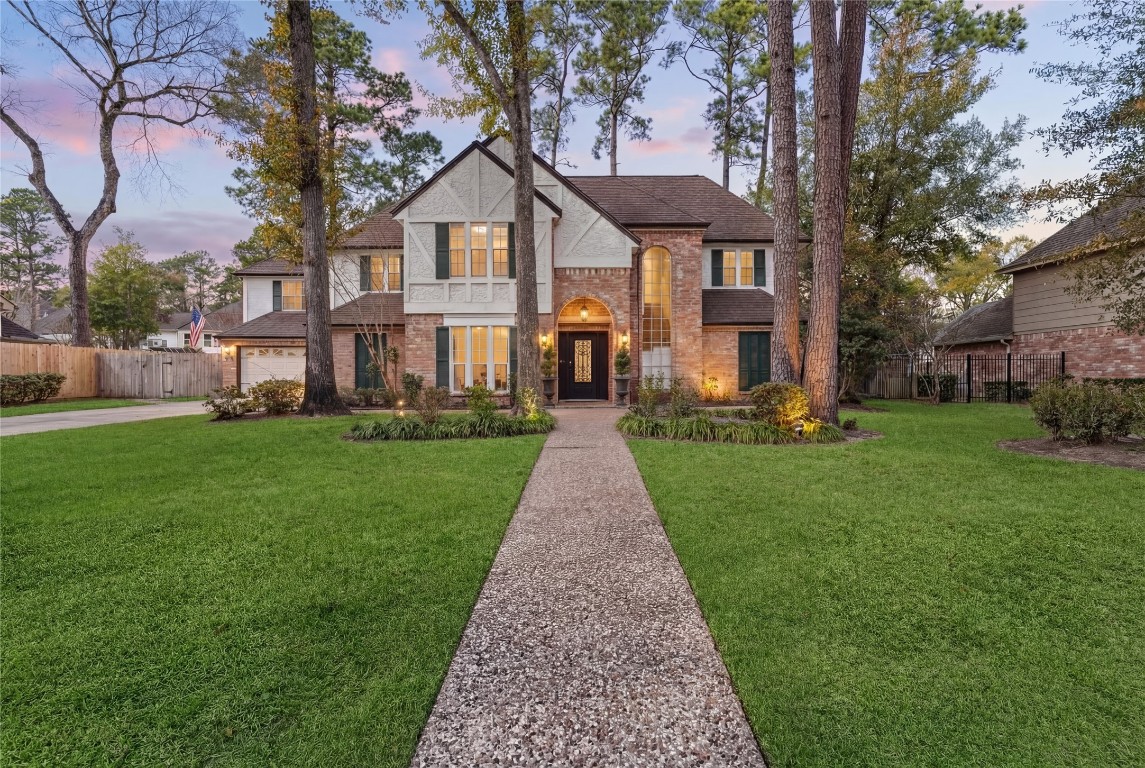 16011 Stratton Park Drive Spring, TX 77379 - Photo 2 of 47 a front view of a house with a yard and potted plants