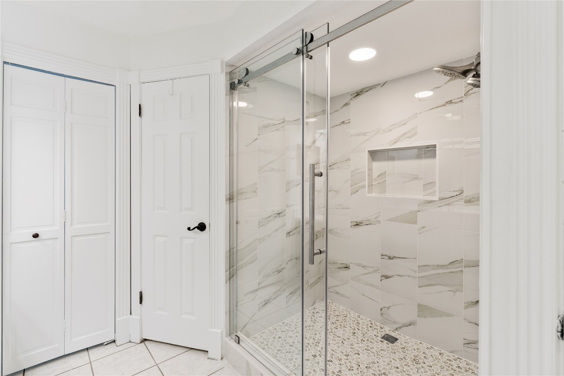 16011 Stratton Park Drive Spring, TX 77379 - Photo 22 of 47 a bathroom with a shower and a glass door