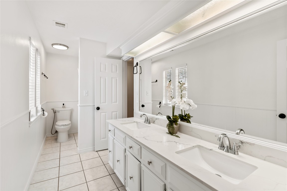 16011 Stratton Park Drive Spring, TX 77379 - Photo 28 of 47 a spacious bathroom with a double vanity sink mirror and toilet