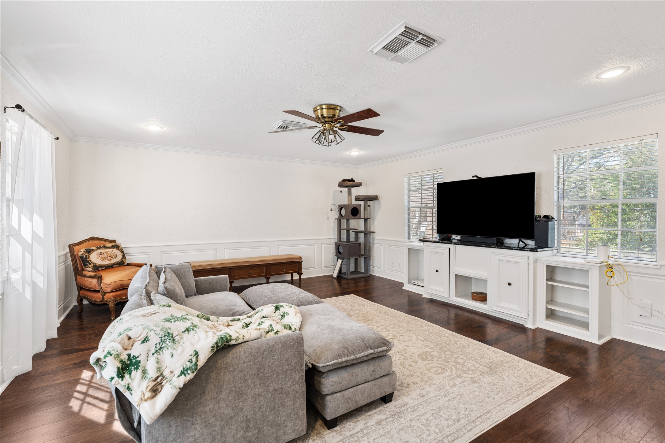 16011 Stratton Park Drive Spring, TX 77379 - Photo 30 of 47 a living room with furniture and a flat screen tv