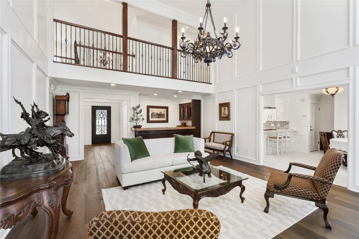 16011 Stratton Park Drive Spring, TX 77379 - Photo 3 of 47 a living room with furniture a chandelier and a rug