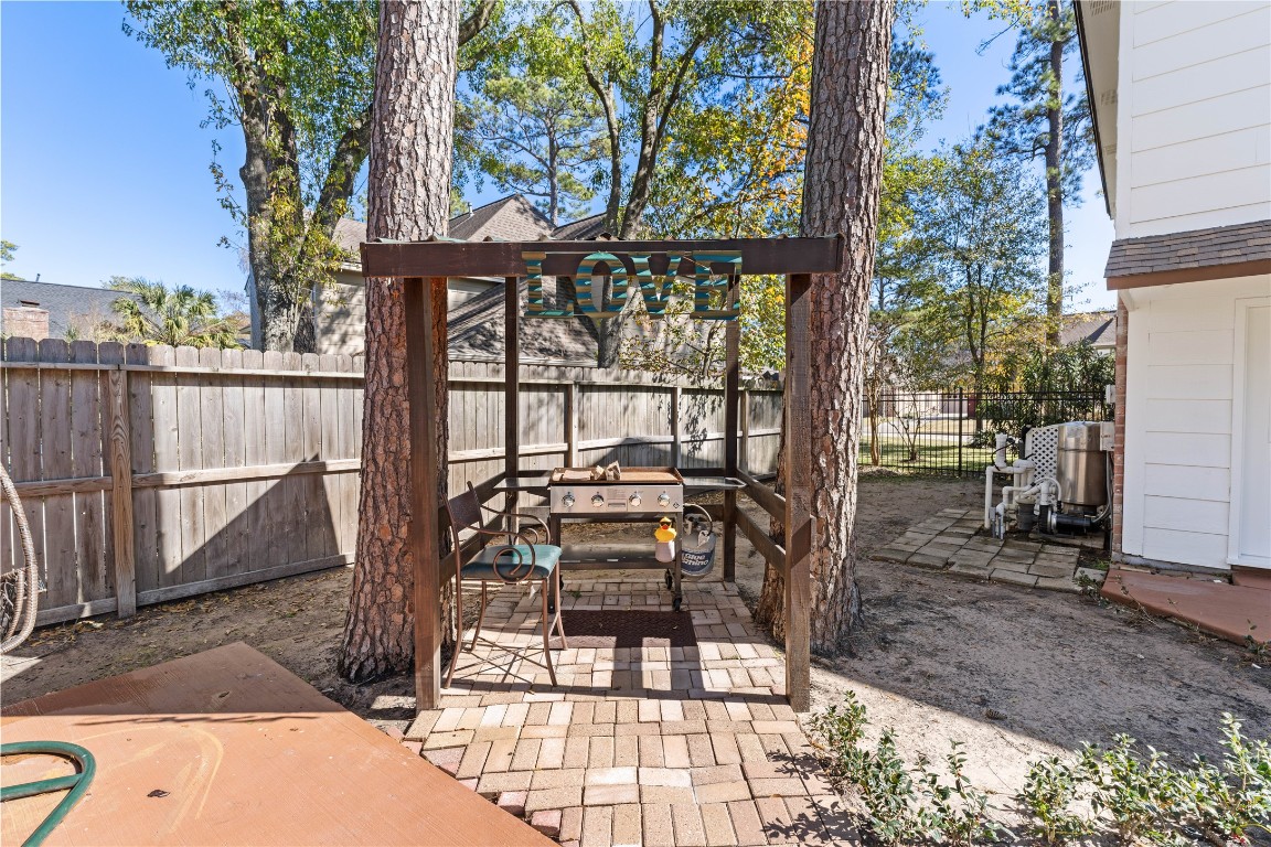 16011 Stratton Park Drive Spring, TX 77379 - Photo 37 of 47 a view of a patio with a table chairs and backyard