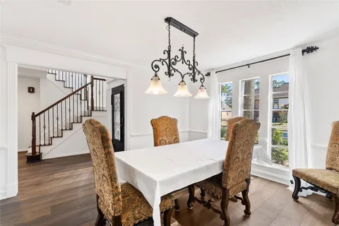 a living room with furniture a clock and a fireplace