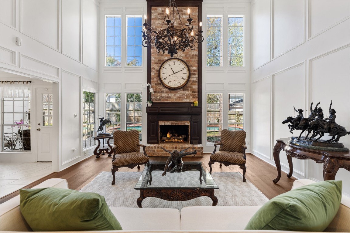 16011 Stratton Park Drive Spring, TX 77379 - Photo 9 of 47 a living room with furniture a clock and a fireplace