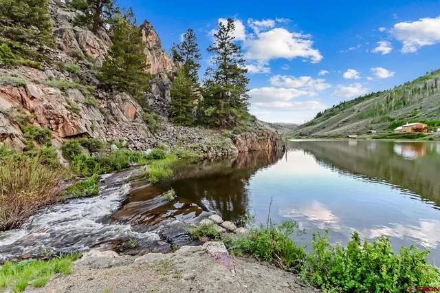 a view of a lake with a yard