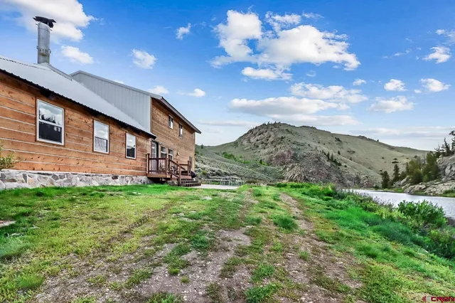 a backyard of a house with lots of green space
