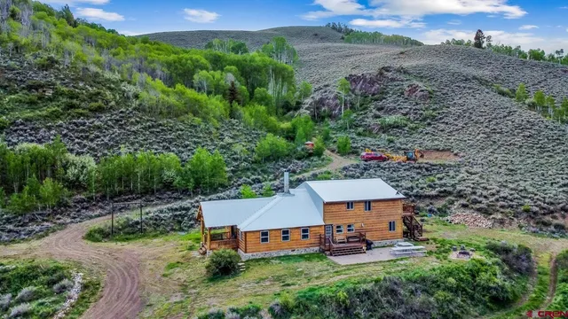 an aerial view of a house with garden