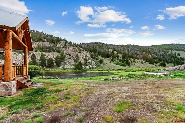 a view of a golf course with a lake