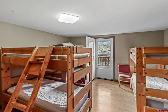 a bed room with a bed and a chair