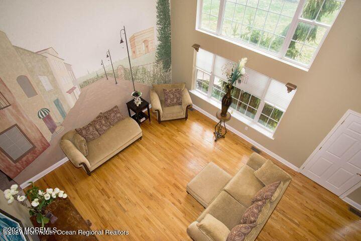 467 Leesville Road Jackson, NJ 08527 - Photo 5 of 19 a living room with furniture and a floor to ceiling window
