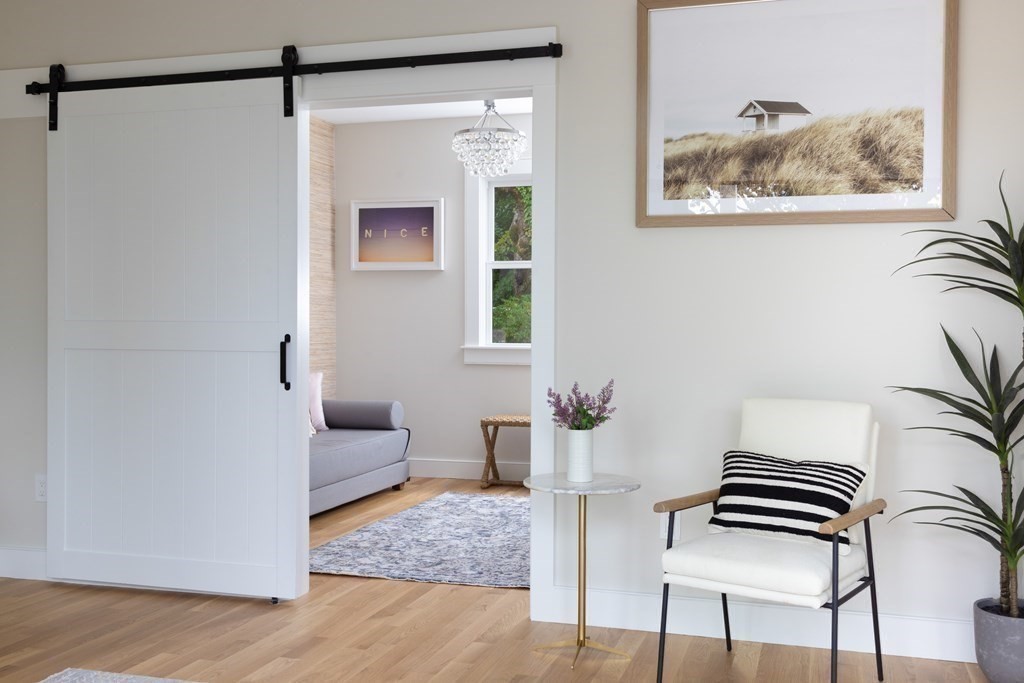 111 Jordan Road Brookline, MA 02446 - Photo 16 of 42 a view of an empty room with a window and wooden floor