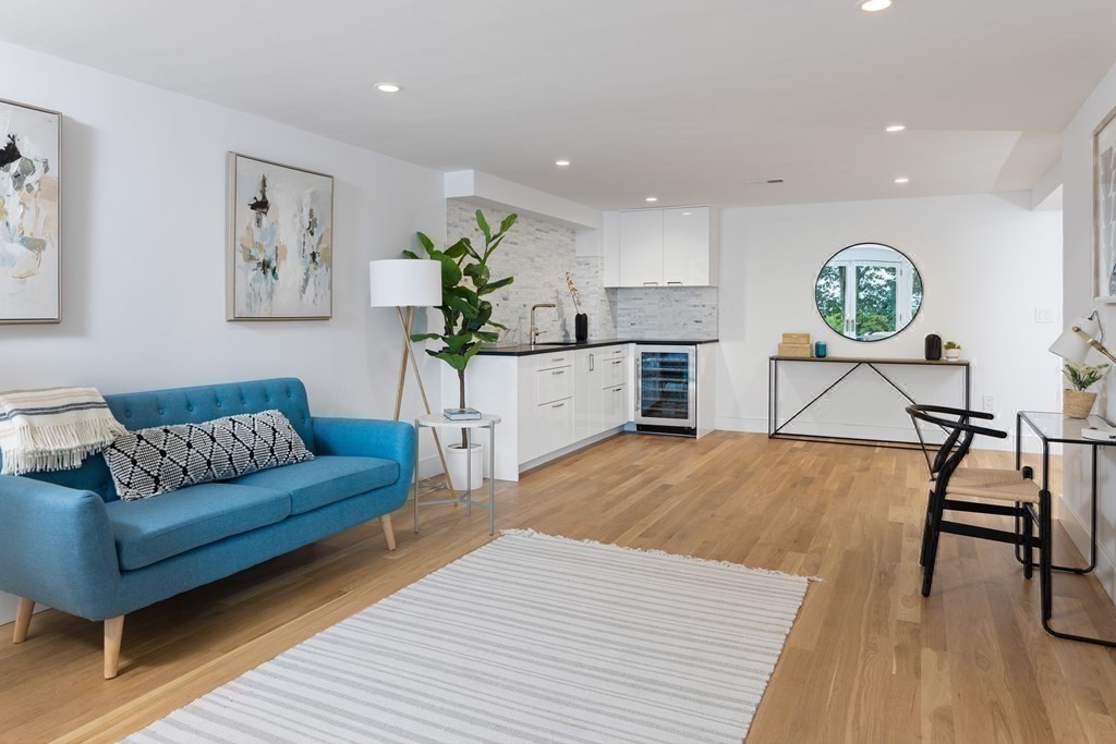 111 Jordan Road Brookline, MA 02446 - Photo 30 of 42 a living room with furniture and a wooden floor