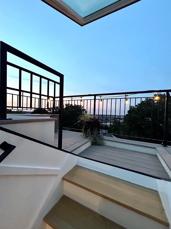 111 Jordan Road Brookline, MA 02446 - Photo 38 of 42 a view of balcony with two couches and wooden floor