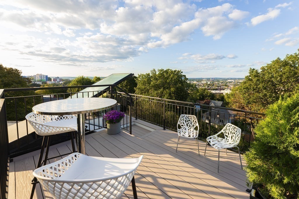 111 Jordan Road Brookline, MA 02446 - Photo 39 of 42 a balcony with table and chairs